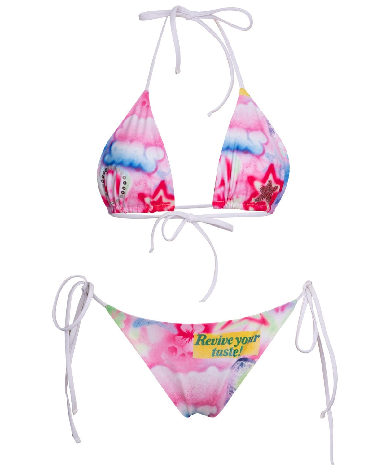 A two-piece string bikini set with a vibrant pink, blue, and white tie-dye pattern. The top has triangle cups with white side ties, and the bottom is a classic g-string style with side ties and a yellow graphic text print that reads 'Revive your taste!'.